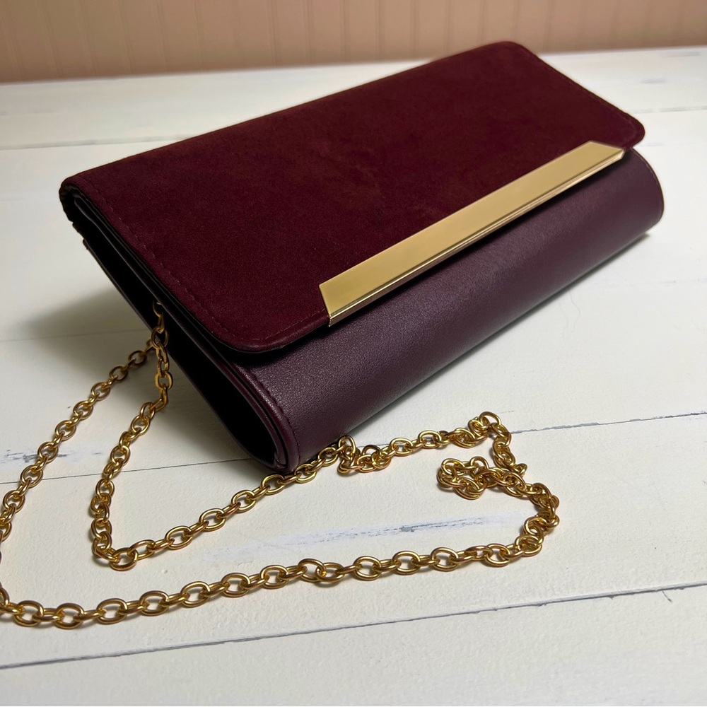 Plum colored crossbody / clutch with gold details